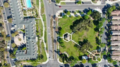 A aerial view of Ladera Ranch, California, showing a variety of buildings and open space.